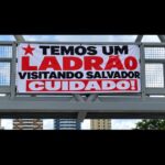 Faixa com críticas a Lula é exibida em Salvador durante visita do presidente